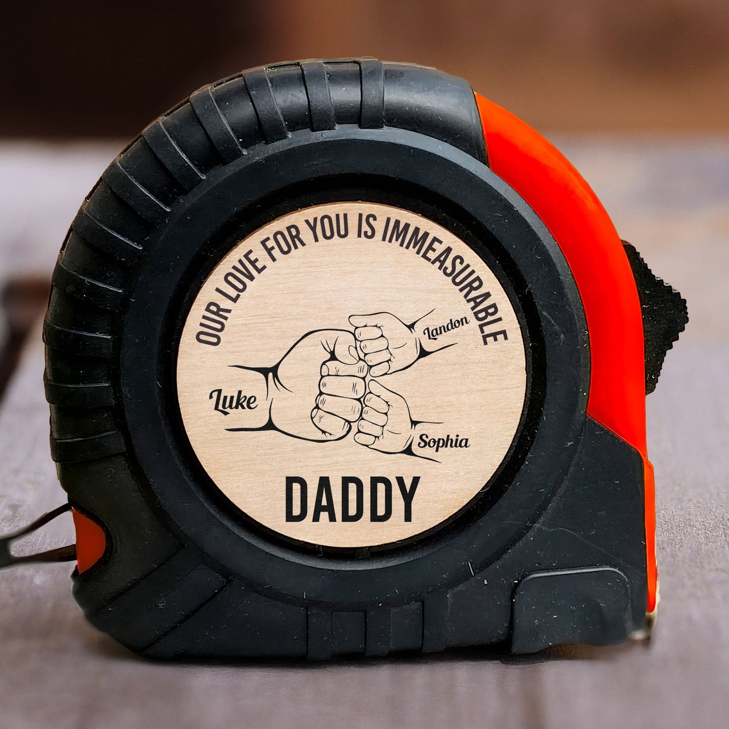 Personalized tape measure for Daddy with 'Our love for you is immeasurable' message, a perfect Father's Day gift.