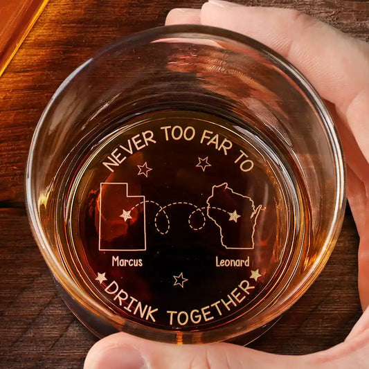 Personalized engraved whiskey glass with 'Never Too Far To Drink Together' design, a perfect gift for friends and family.