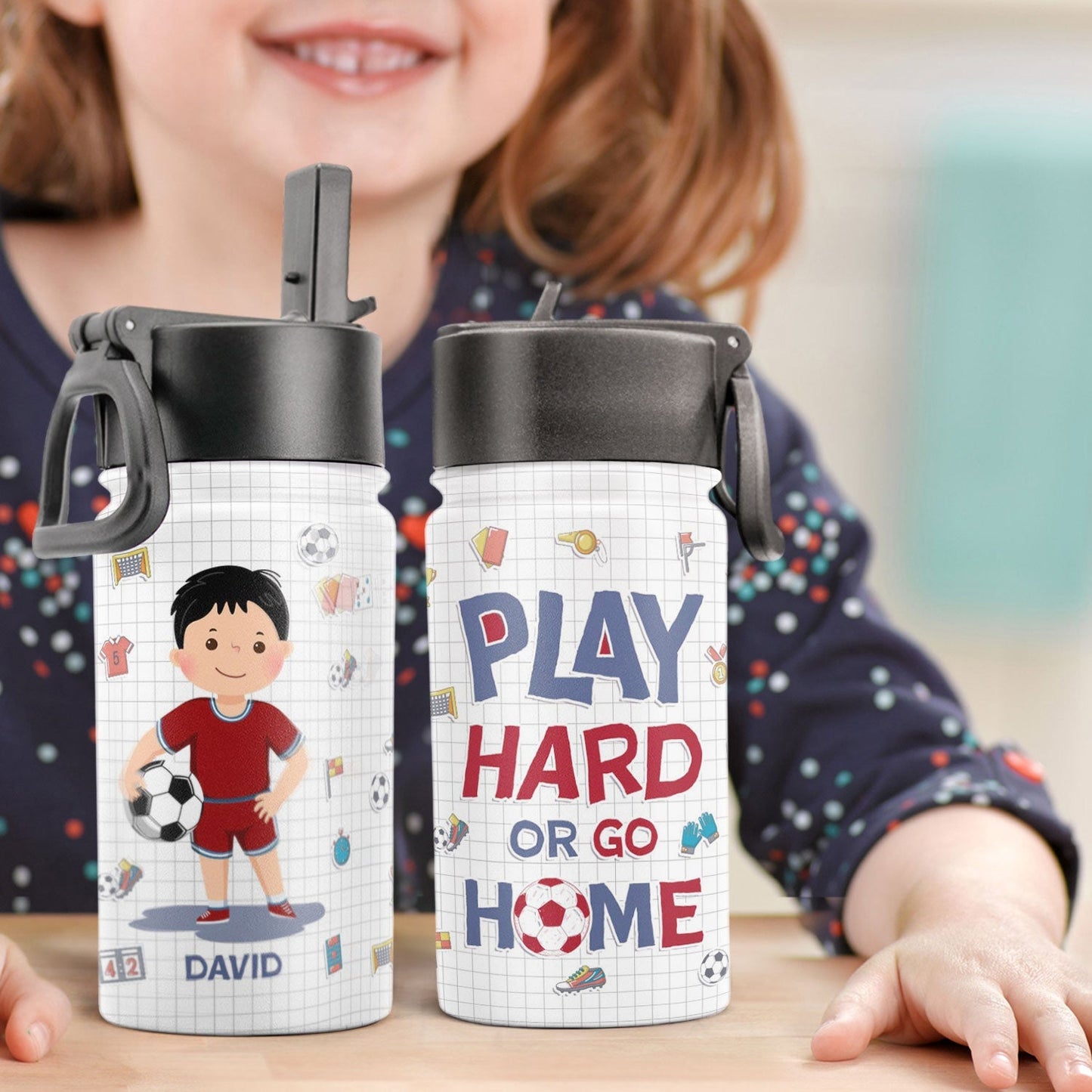 Personalized ice soccer water bottle for kids with straw lid, featuring 'Play Hard or Go Home' and a soccer player design.