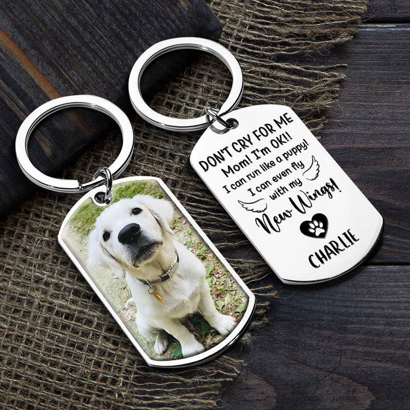 Personalized photo memorial keychain with a dog image and engraved memorial quote. Stainless steel.